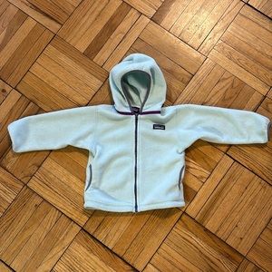 Patagonia synchilla toddler jacket light mint with purple trim.